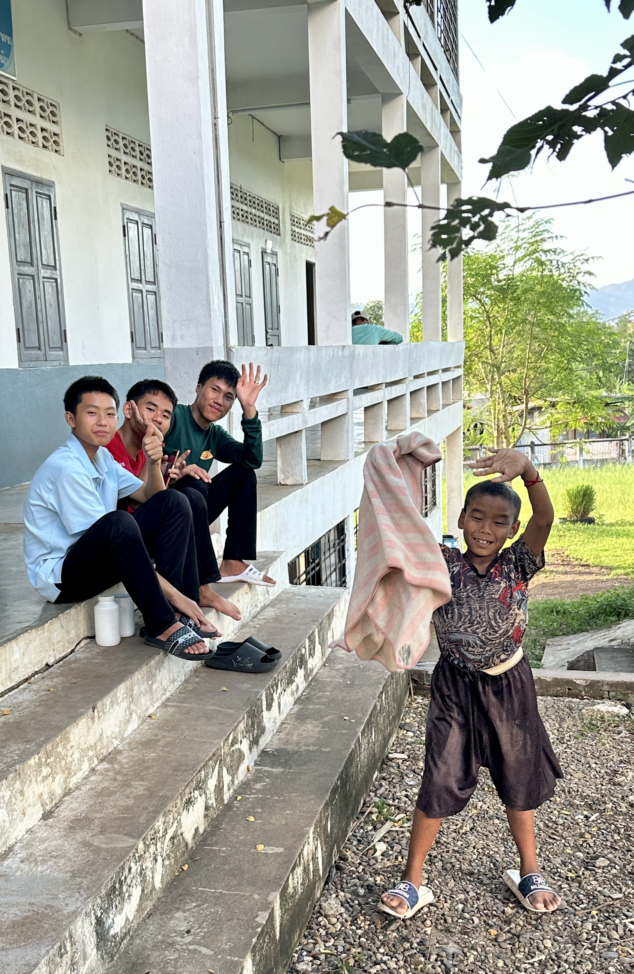 Students interacting naturally on the school steps
