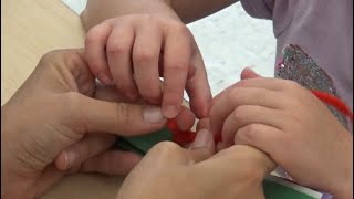 Hands using hand-under-hand tactile communication support