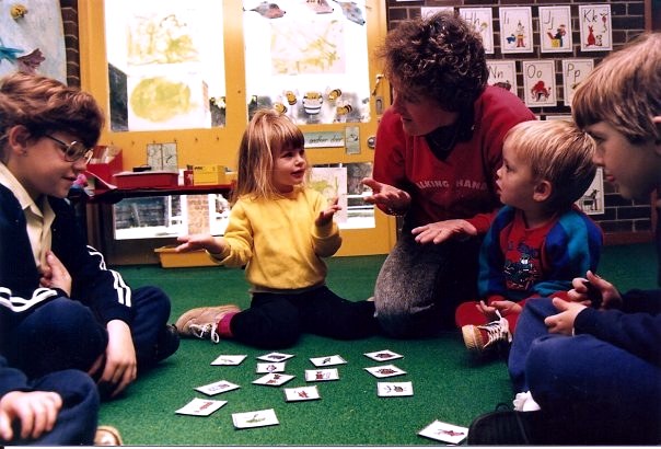 Julie teaching young Deaf children in a preschool classroom