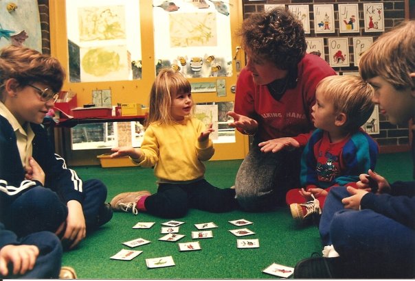 Julie teaching young Deaf children in a preschool classroom