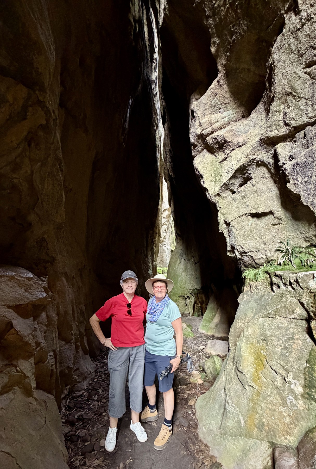 Julie and Kel standing inside the sandstone Amphitheatre at Carnarvon Gorge