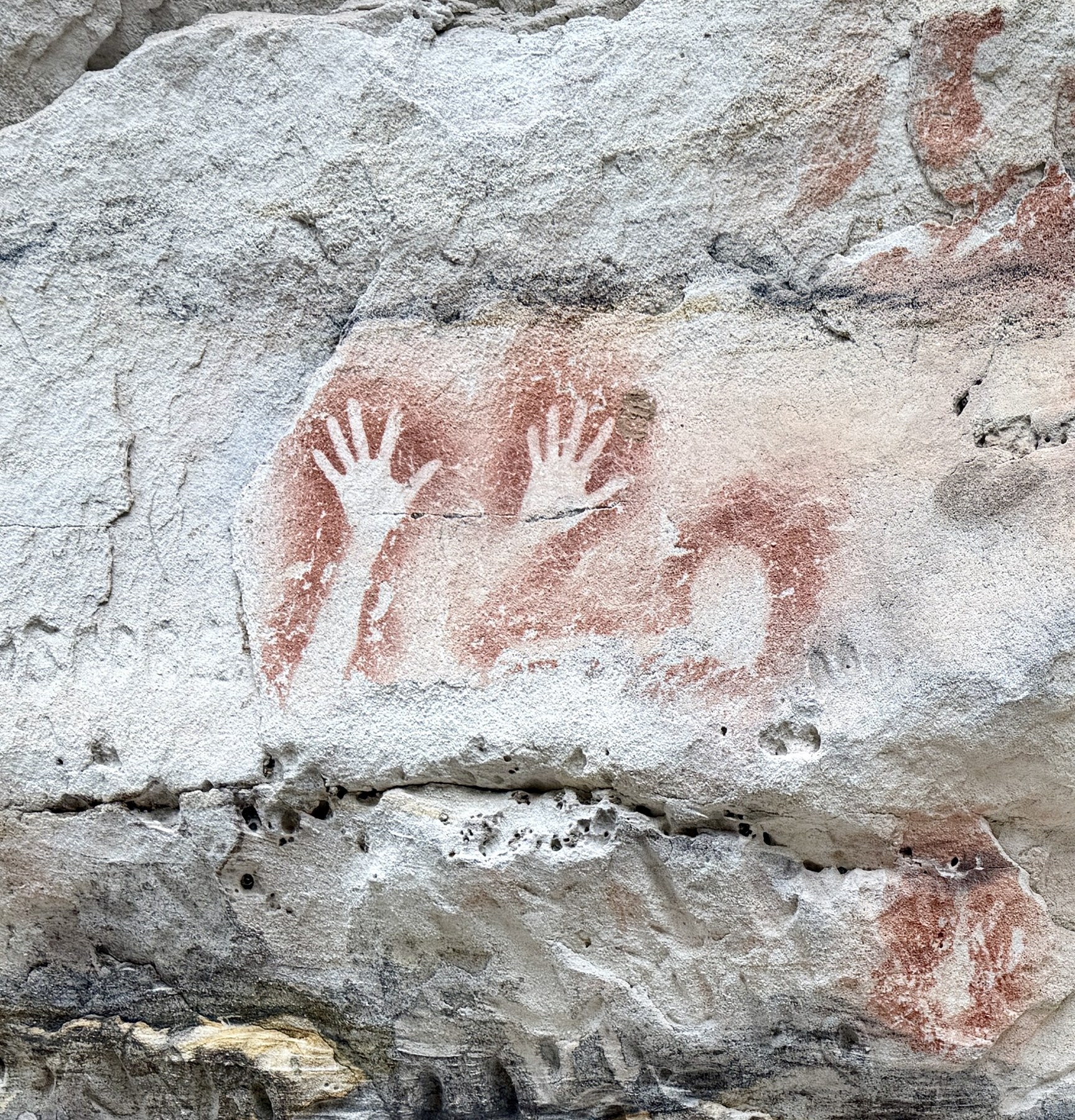 Aboriginal hand stencils and ochre markings on sandstone at Carnarvon Gorge Art Gallery