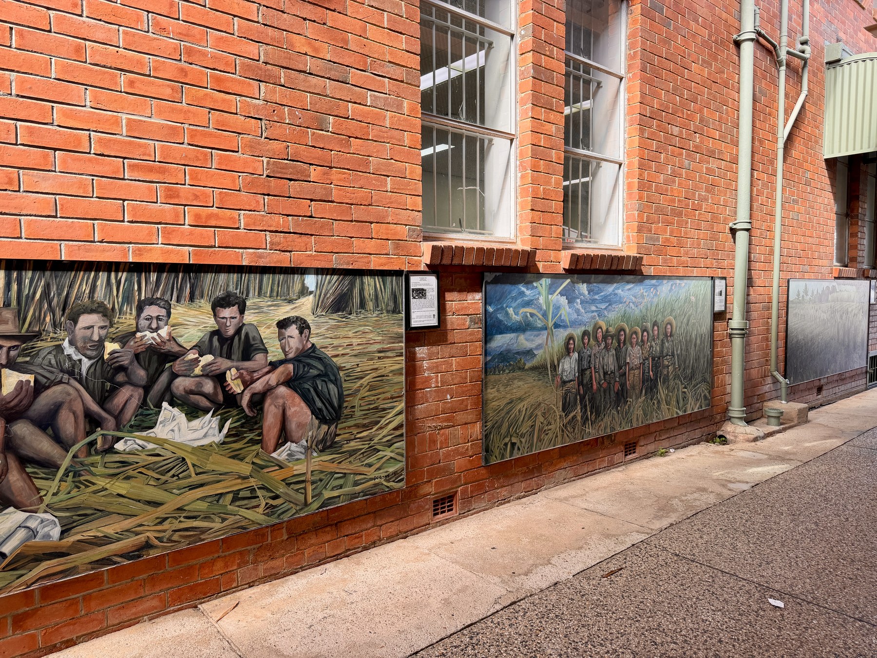 Painted wall art showing local scenes in Ravenshoe