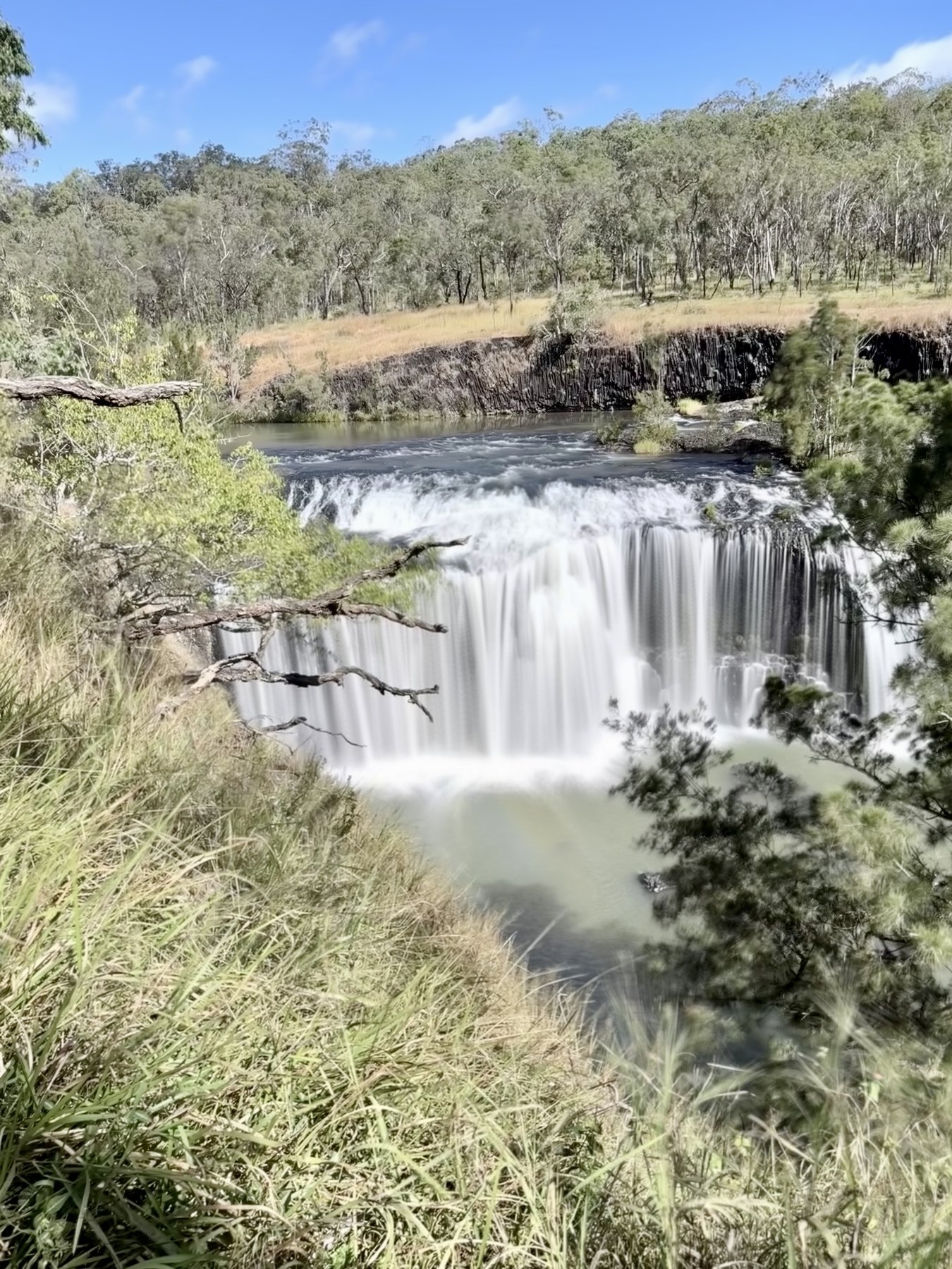 Millstream Falls flowing over a wide rock ledge