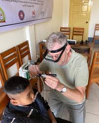 Dr Antoine Perdu conducting an ear examination